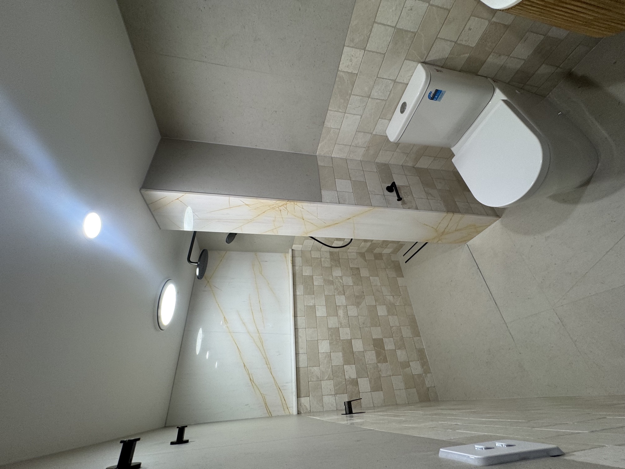 Bathroom shower side with stone wall tile