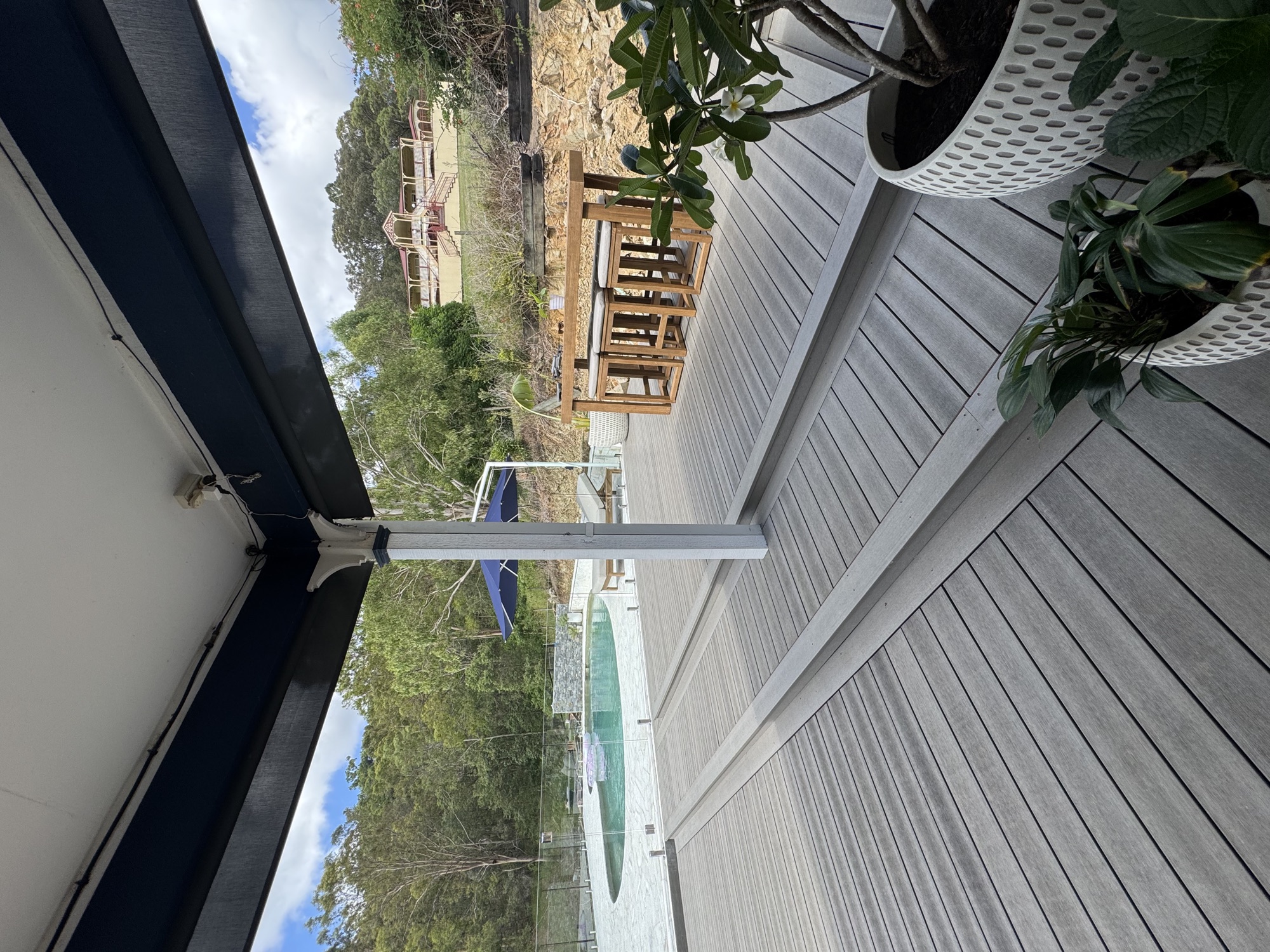 Composite deck with glass balustrade and acreage view
