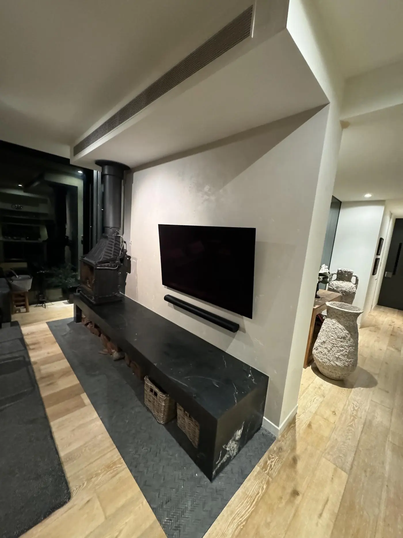 Living room with feature stone fireplace hearth