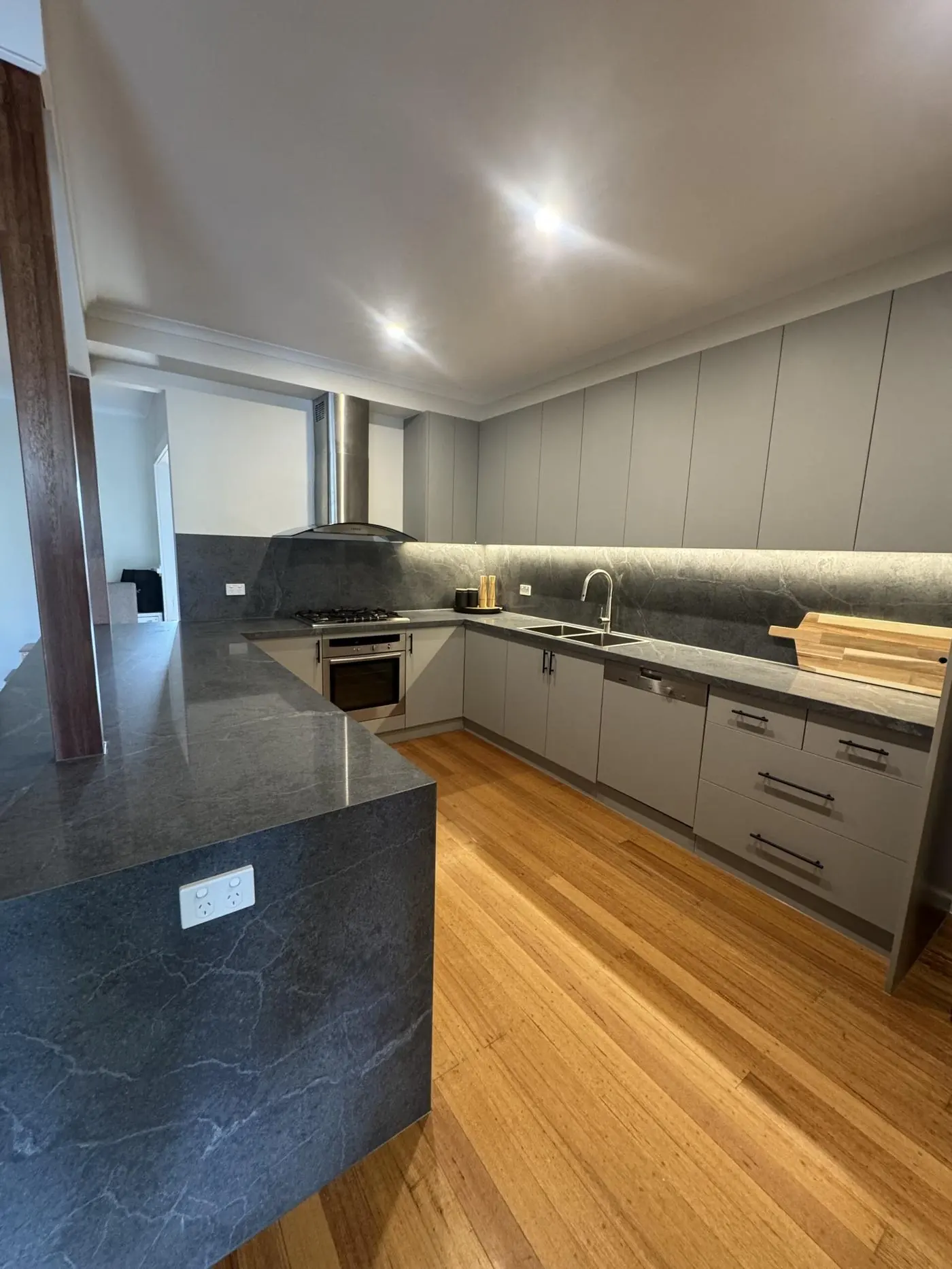 Grey kitchen renovation with island bench
