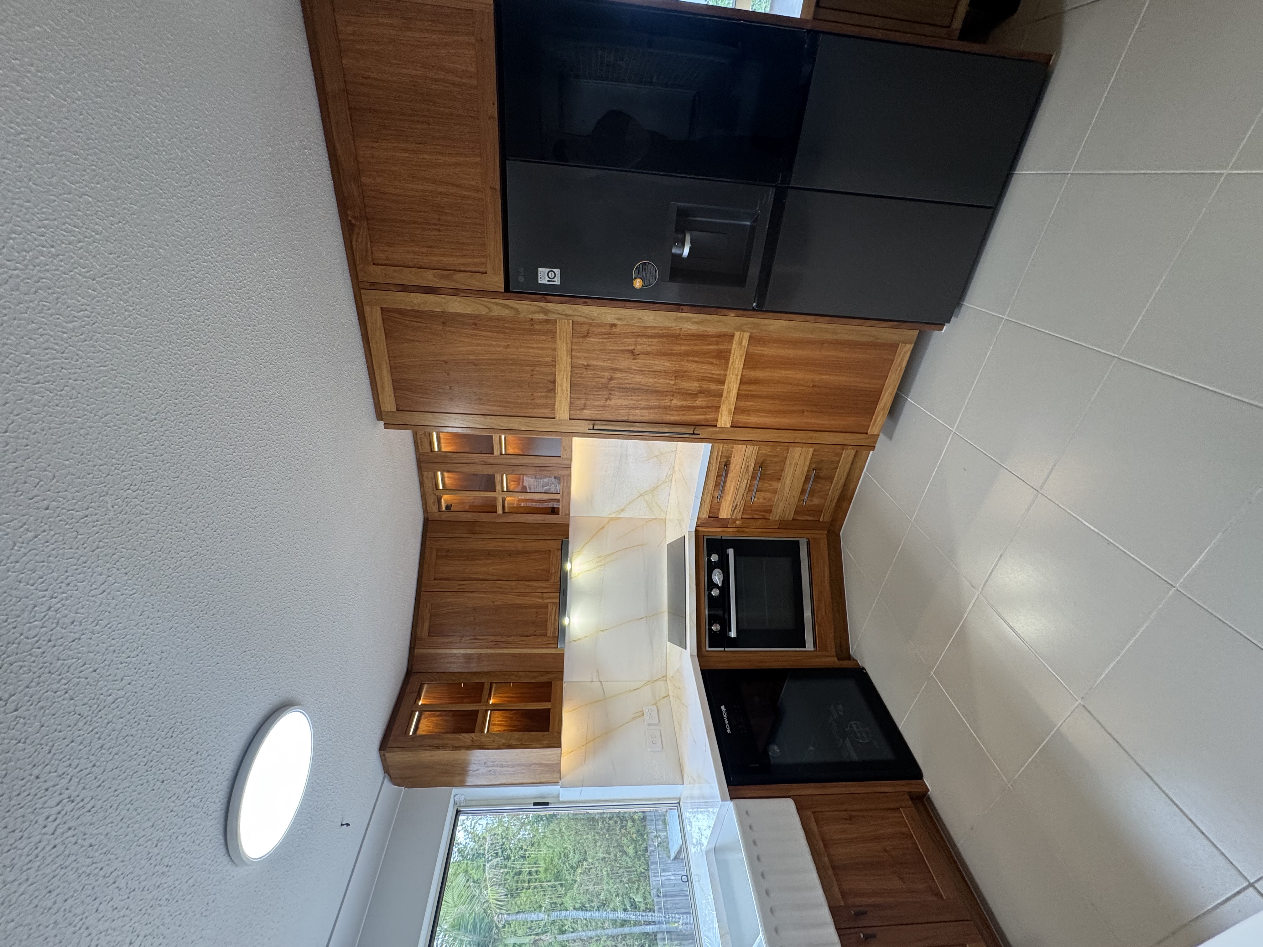 Appliance column with timber cabinetry